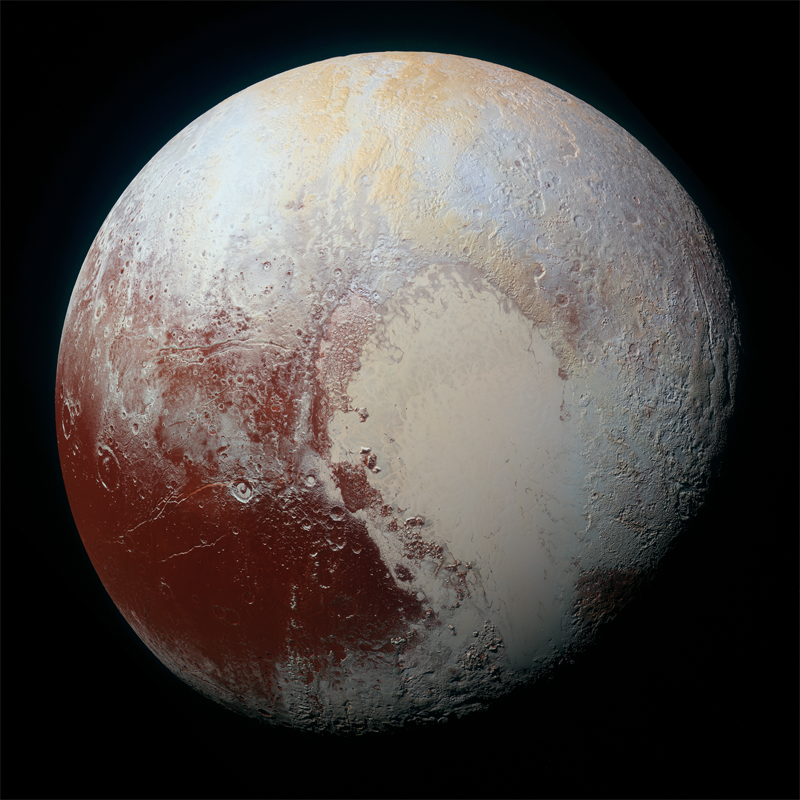 写真:冥王星の表面は赤茶けた地質と氷に覆われている